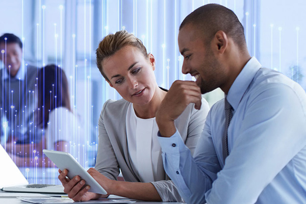 Employees working in office, overlaid with OpenBlue graphics